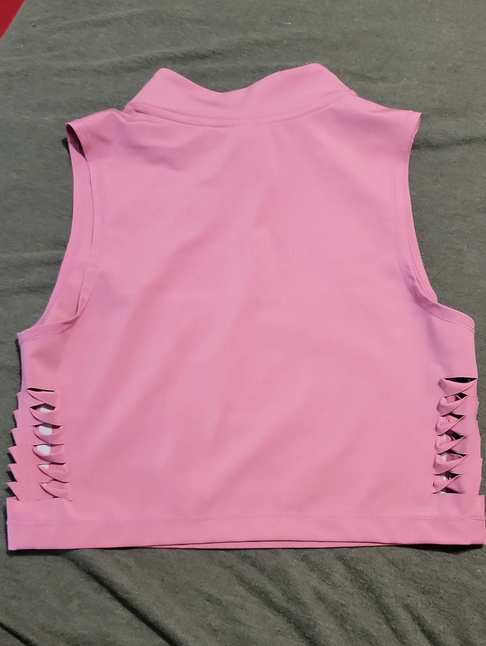 pink Nike Pro Dri-FIT crop top featuring distinctive side-cutout details